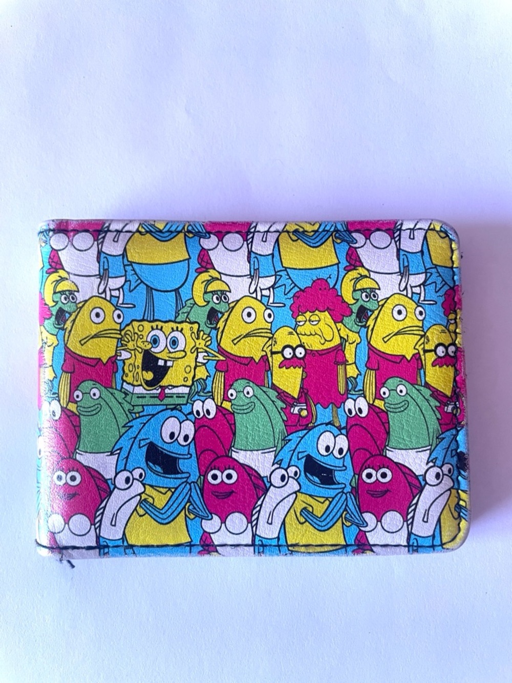 Buckle-Down Cartoon Crowd Bifold Wallet in Yellow, Blue, Pink, Green